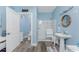 Stylishly designed bathroom features a glass shower, vanity, and coastal-themed decor offering a clean and relaxing space at 9240 Pine Cove Dr, Englewood, FL 34224
