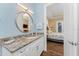 This elegant bathroom is light and airy, and gives access to the primary bedroom at 9240 Pine Cove Dr, Englewood, FL 34224