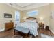 The bedroom features wood-look floors and a ensuite bathroom with a separate vanity at 9240 Pine Cove Dr, Englewood, FL 34224