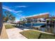 A covered boat dock with a boat lift provides convenient access to the waterfront at 9240 Pine Cove Dr, Englewood, FL 34224