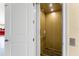 Interior view of a residential elevator with wood paneling, offering convenient access between floors at 9240 Pine Cove Dr, Englewood, FL 34224