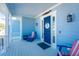 Inviting front porch with coastal decor and seating at 9240 Pine Cove Dr, Englewood, FL 34224