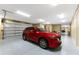 Spacious garage with epoxy floor and ample storage space for vehicles and equipment at 9240 Pine Cove Dr, Englewood, FL 34224