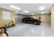 Spacious garage with epoxy floor and ample storage space at 9240 Pine Cove Dr, Englewood, FL 34224
