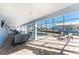 Blue outdoor lanai features a seating area and dining set alongside the pool, creating an ideal outdoor retreat at 9240 Pine Cove Dr, Englewood, FL 34224