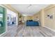 Spacious living room with sliding glass doors, comfortable seating, and light hardwood flooring for a warm, inviting atmosphere at 9240 Pine Cove Dr, Englewood, FL 34224