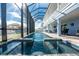 Enclosed pool area with inviting in-ground pool and plenty of room for outdoor lounging at 9240 Pine Cove Dr, Englewood, FL 34224