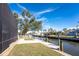 Peaceful waterfront view with private dock and lush landscaping at 9240 Pine Cove Dr, Englewood, FL 34224
