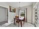 Cozy dining area with marble style floors and natural light from the window at 11247 Euler Ave, Englewood, FL 34224