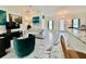 Bright living area with white tile floors, comfortable seating, and a modern design at 11247 Euler Ave, Englewood, FL 34224