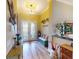 Welcoming foyer with decorative lighting, elegant console table, and charming bench with vibrant decor at 170 Antilla Dr, Rotonda West, FL 33947