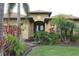 Charming single-Gathering home with tropical landscaping and a well manicured lawn at 170 Antilla Dr, Rotonda West, FL 33947
