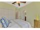 Bedroom boasts a ceiling fan, large closet and adjoining bathroom at 20211 Granlago Dr, Venice, FL 34293