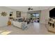 Inviting living room with comfortable seating, stylish decor, and serene lake views at 20211 Granlago Dr, Venice, FL 34293