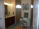 Elegant bathroom featuring a large mirror, modern vanity, and tiled walk-in shower with natural lighting at 380 Hoffer St, Port Charlotte, FL 33953