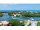 Breathtaking aerial view showcases a waterfront property near tranquil waterways and lush greenery at 396 N Gulf Blvd, Placida, FL 33946