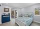 This bedroom has a coastal theme and includes a sliding door to a deck for enjoying the outdoors at 396 N Gulf Blvd, Placida, FL 33946