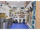 Tidy storage room features ample shelving, tools, and equipment neatly arranged on blue flooring at 396 N Gulf Blvd, Placida, FL 33946