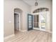 Inviting home entrance featuring an arched doorway and charming blue front door at 116 Hercules Dr, Rotonda West, FL 33947