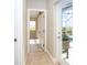 Hallway leading to a room with a view and an exit leading to the outdoor grill and pool area at 116 Hercules Dr, Rotonda West, FL 33947