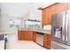 Spacious kitchen features stainless steel appliances, granite countertops, and ample wood cabinetry at 116 Hercules Dr, Rotonda West, FL 33947