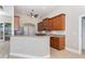 Kitchen featuring granite countertops, wooden cabinetry, and stainless steel appliances at 116 Hercules Dr, Rotonda West, FL 33947