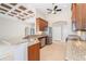 Kitchen with granite countertops, stainless steel appliances, and adjacent living area at 116 Hercules Dr, Rotonda West, FL 33947