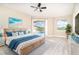 Inviting main bedroom with lanai access, a king bed, cool coastal accents, and lots of natural light at 116 Hercules Dr, Rotonda West, FL 33947