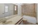 Bathroom with shower-tub combo, granite vanity, and view of the exit door at 3568 Middletown St, Port Charlotte, FL 33952