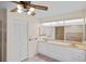 Bathroom featuring double sinks, tile floors, a large mirror, and vanity cabinets at 3568 Middletown St, Port Charlotte, FL 33952