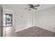A view of the bedroom with a ceiling fan, closet, and wood-style flooring at 3568 Middletown St, Port Charlotte, FL 33952