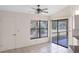 Tile-floored dining area with a large window and a glass door leading to a patio at 3568 Middletown St, Port Charlotte, FL 33952