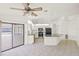 An eat-in kitchen with an island, white cabinetry, stainless steel appliances, and an adjacent dining area at 3568 Middletown St, Port Charlotte, FL 33952