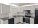 Close-up of the kitchen's cabinets, counters, appliances, and a window over the sink at 3568 Middletown St, Port Charlotte, FL 33952