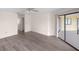 Open concept living room featuring hardwood floors and sliding glass doors leading to the exterior at 3568 Middletown St, Port Charlotte, FL 33952