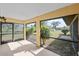 A view of the screened-in porch with a beautiful view of the property's backyard at 3568 Middletown St, Port Charlotte, FL 33952