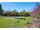 Outdoor shuffleboard courts surrounded by green space and mature trees, perfect for community recreation at 4260 Placida Rd # 12C, Englewood, FL 34224