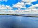 Aerial view of a long bridge over a vast body of water and bright blue sky at 5231 Conner Ter, Port Charlotte, FL 33981