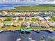 Aerial view of waterfront homes with boat docks and lifts in a beautiful waterfront community at 5231 Conner Ter, Port Charlotte, FL 33981