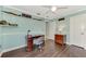 Well-lit bedroom with hardwood floors, built-in shelves, and a comfortable workspace at 5231 Conner Ter, Port Charlotte, FL 33981