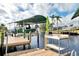 Dock with a boat lift, offering direct access to the water and stunning waterfront views at 5231 Conner Ter, Port Charlotte, FL 33981