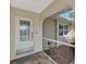 Inviting front porch featuring a decorative glass door, decorative stone, and a welcoming entrance at 5231 Conner Ter, Port Charlotte, FL 33981