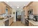 Bright kitchen with stainless steel appliances, marble countertops, and a view into the dining room at 5231 Conner Ter, Port Charlotte, FL 33981