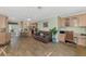 Open concept living area with tile floors, neutral walls, and seamless flow to the kitchen at 5231 Conner Ter, Port Charlotte, FL 33981