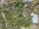 Unique aerial view of the property featuring winding boardwalk through lush landscapes and waterway access at 7475 Manasota Key Rd, Englewood, FL 34223