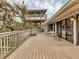 Expansive deck with outdoor seating and a view of the home's unique tower structure at 7475 Manasota Key Rd, Englewood, FL 34223