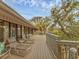 Expansive deck area with lounge chairs and views of lush greenery at 7475 Manasota Key Rd, Englewood, FL 34223