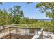 Enjoy picturesque waterfront views from this cozy wooden deck with stylish outdoor seating at 7475 Manasota Key Rd, Englewood, FL 34223