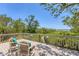 Peaceful deck area with chairs and serene natural views beyond the railing at 7475 Manasota Key Rd, Englewood, FL 34223