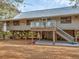 Charming raised home with a balcony offering serene views and an inviting outdoor space at 7475 Manasota Key Rd, Englewood, FL 34223